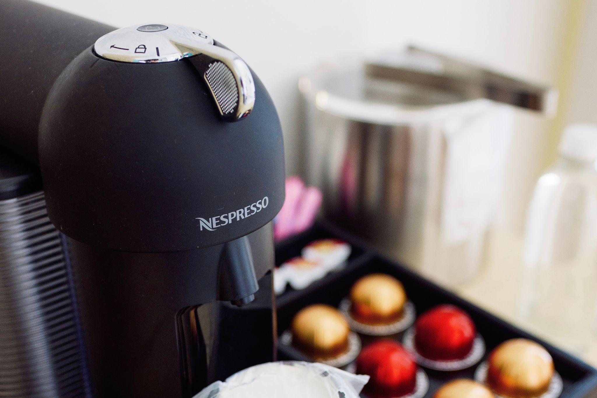 image Elevate your morning routine with a sleek Nespresso machine at your fingertips.