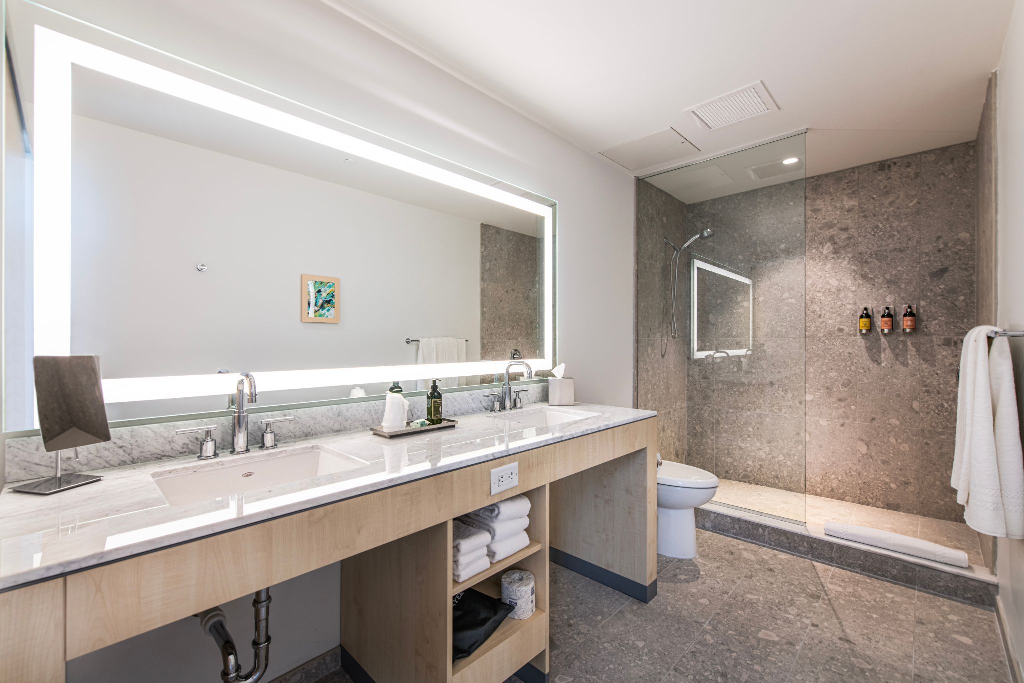 image Elegance shines in the spacious bathroom, where luxury meets practicality with ample counter space and modern fixtures.