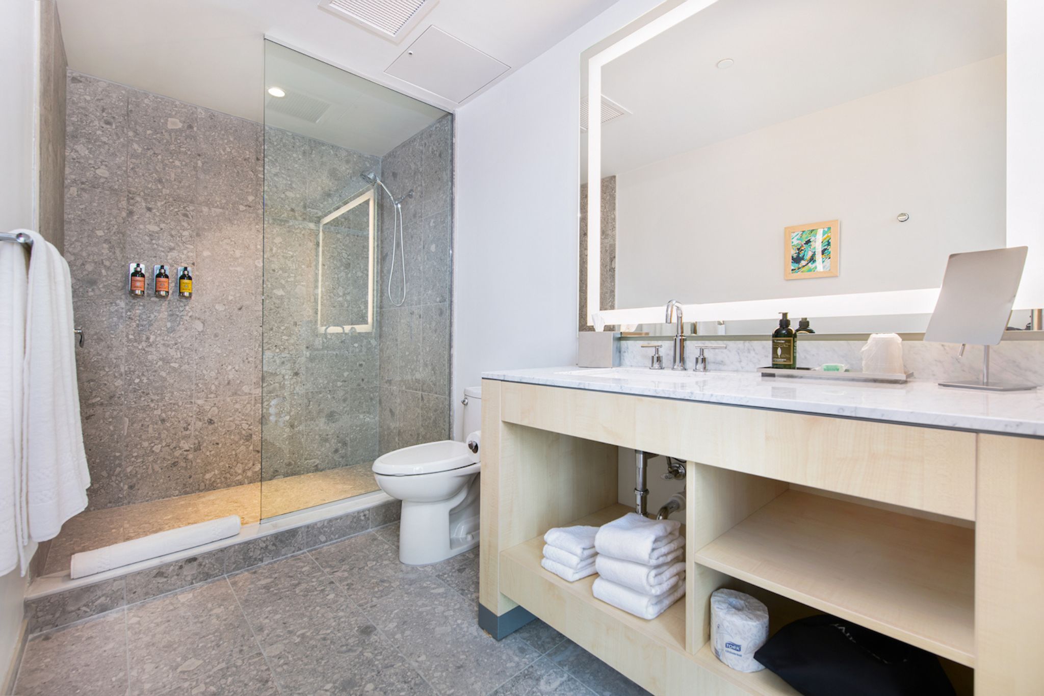 image The refined bathroom features elegant finishes and convenient amenities, ensuring a refreshing start to your day.