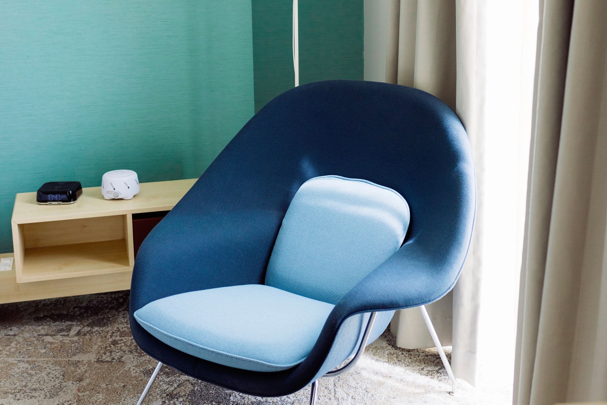 image A chic blue chair invites relaxation, perfectly complementing the modern decor of your lakeside retreat.