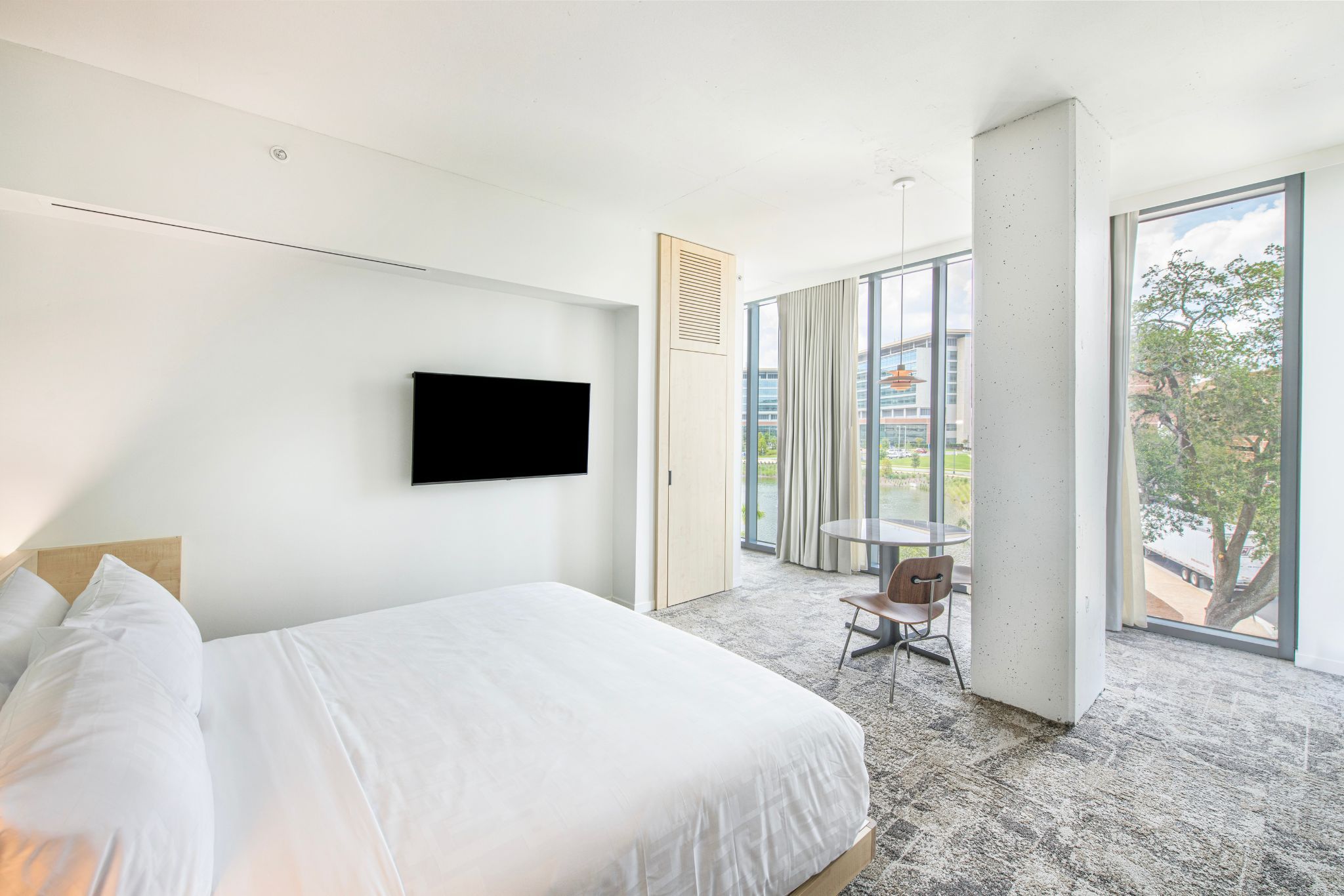 image Experience ultimate comfort in the Lake View Suite, where modern design meets serene views, making your stay a restful retreat.