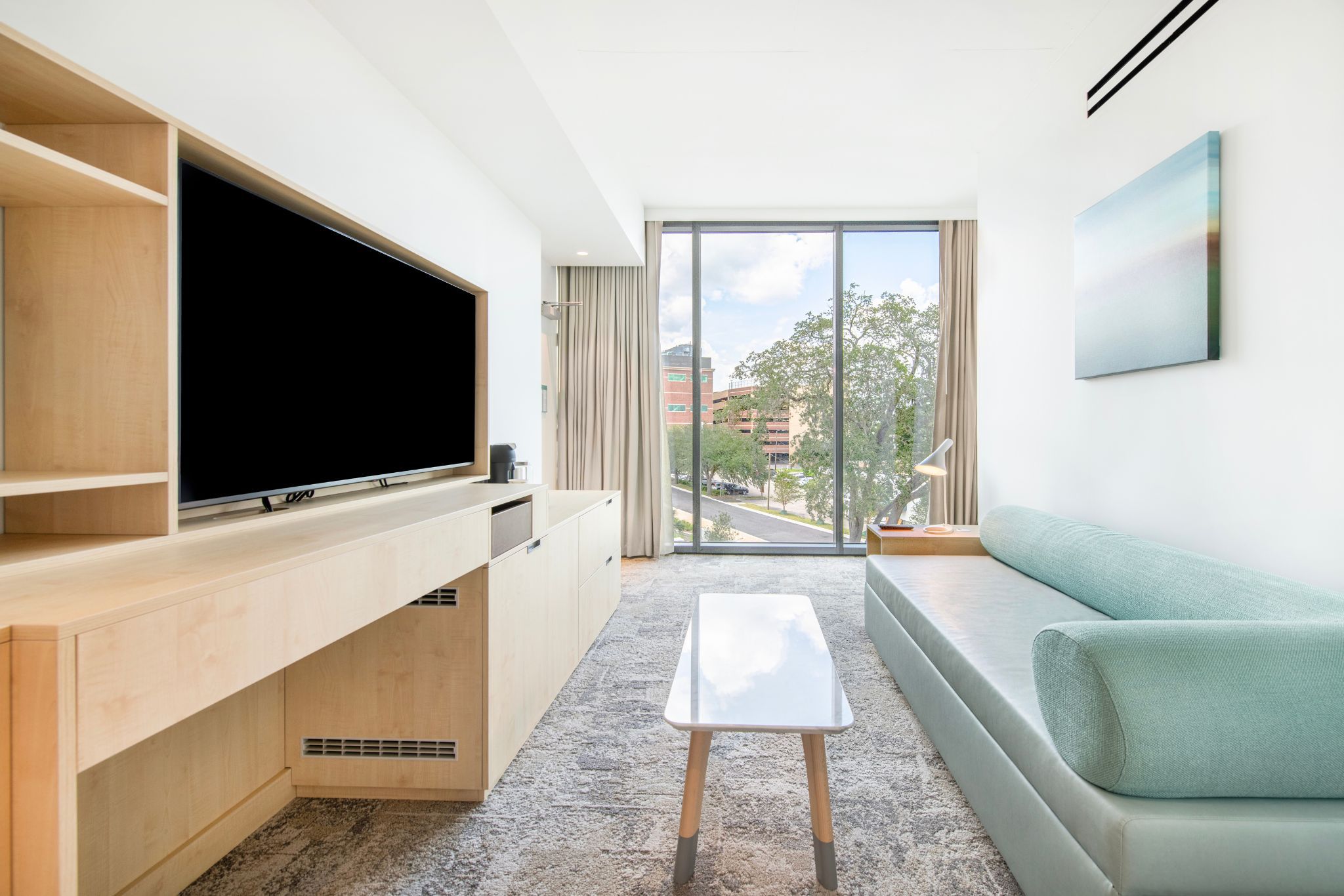 image Bask in natural light and contemporary design in your spacious suite, complete with stunning views of the lakeside.