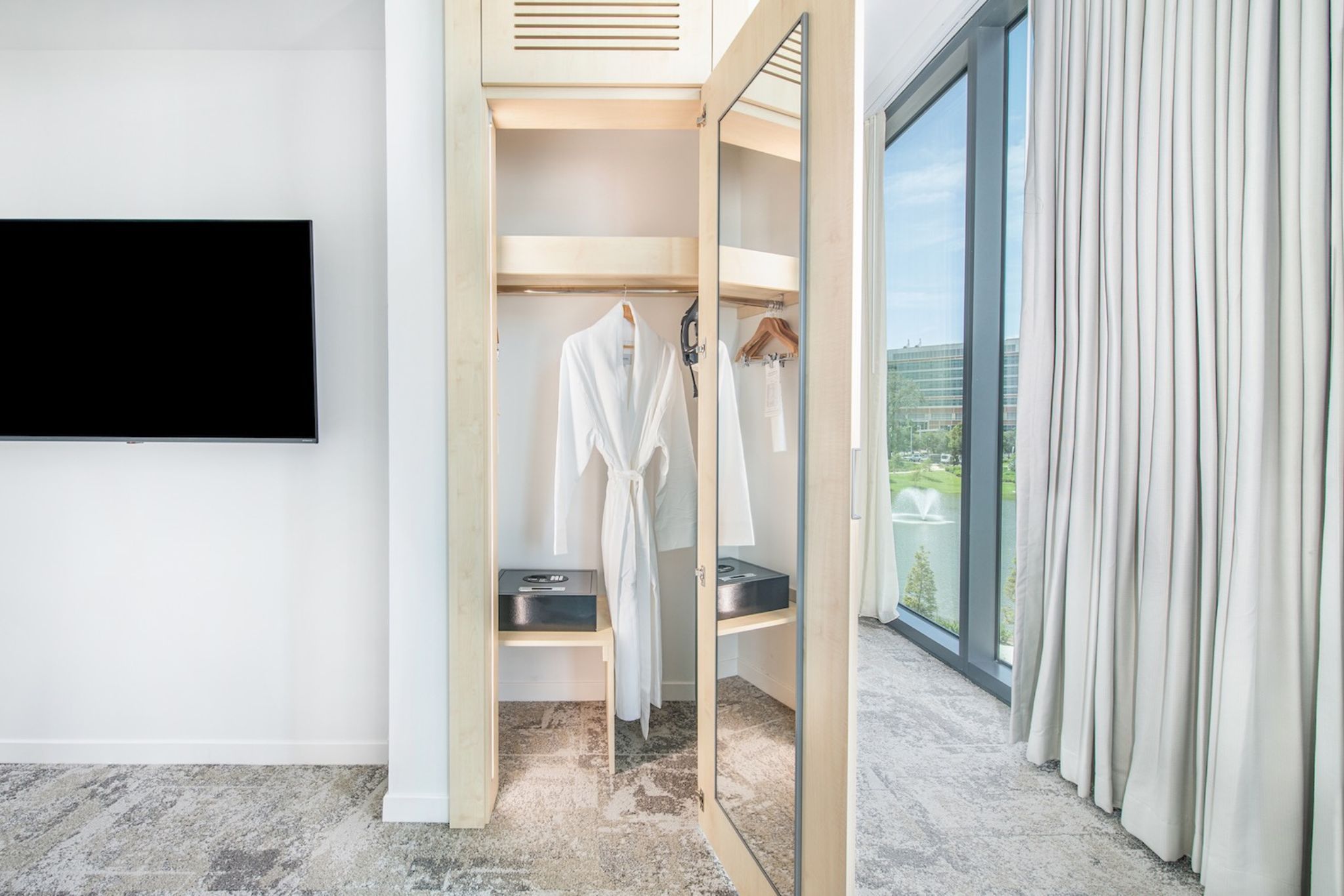 image Enjoy the convenience of a well-designed wardrobe space, featuring plush robes and scenic views that enhance your comfort and style.