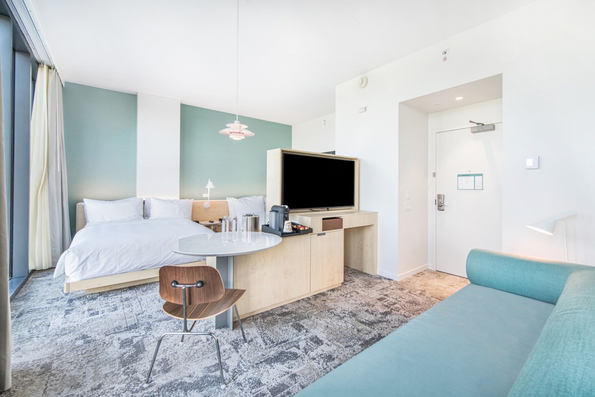 image The spacious City View Guestroom blends modern amenities with comfort, inviting you to unwind while soaking in stunning urban views.