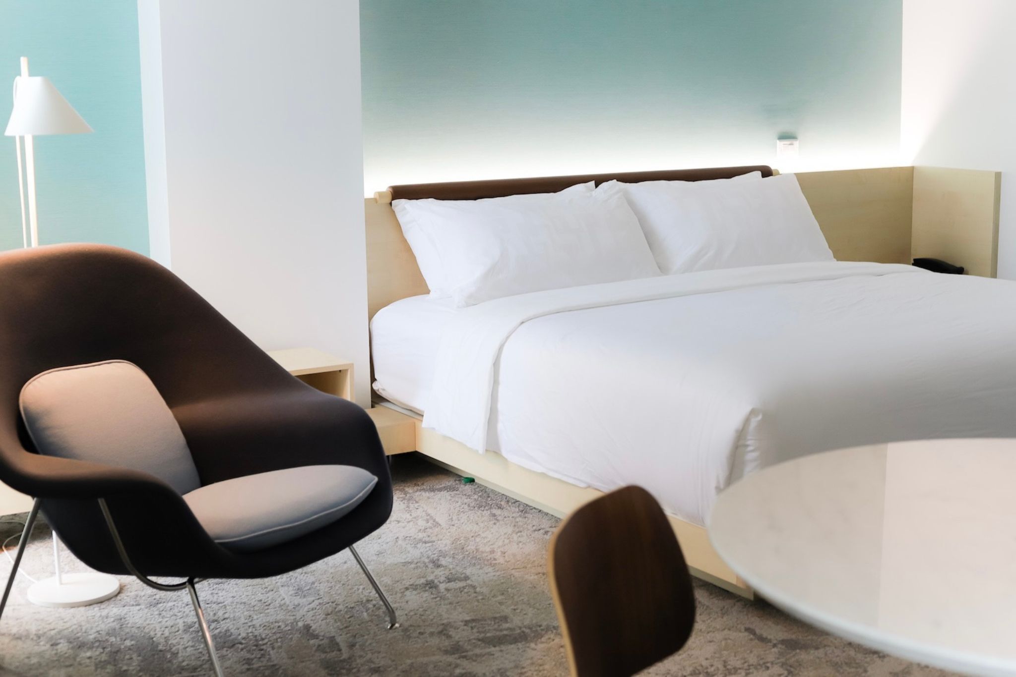 image The cozy bedroom showcases smart design with a plush bed and tasteful decor, promising a restful night's sleep and stunning city views.