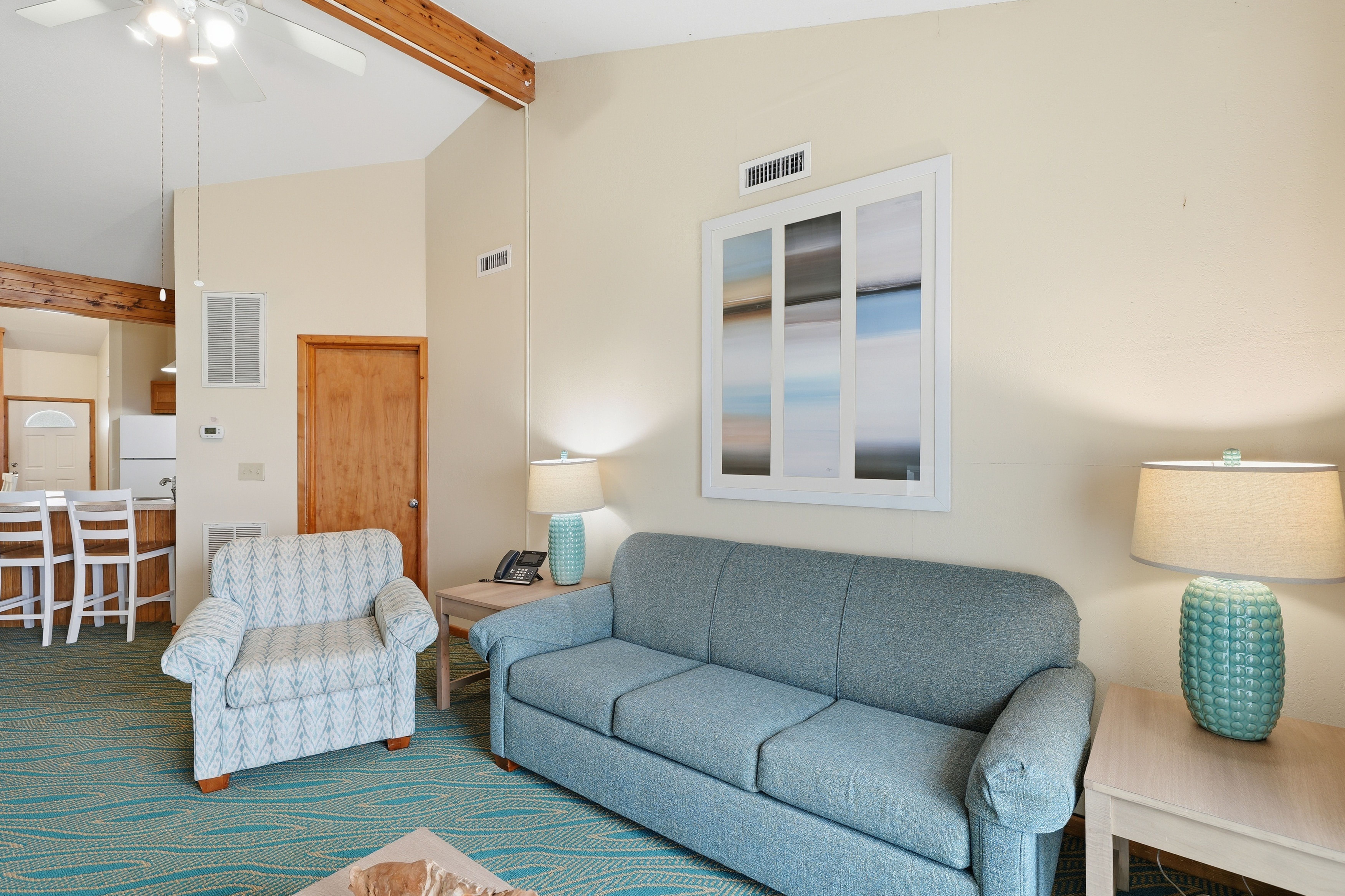 image Relax in style on plush seating, with warm natural light streaming through, creating a perfect atmosphere for unwinding.