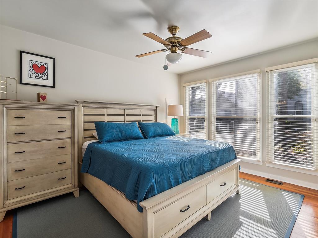 image With its bright decor and ample storage, this stylish bedroom invites relaxation and tranquility, perfect for unwinding after a day at the beach.