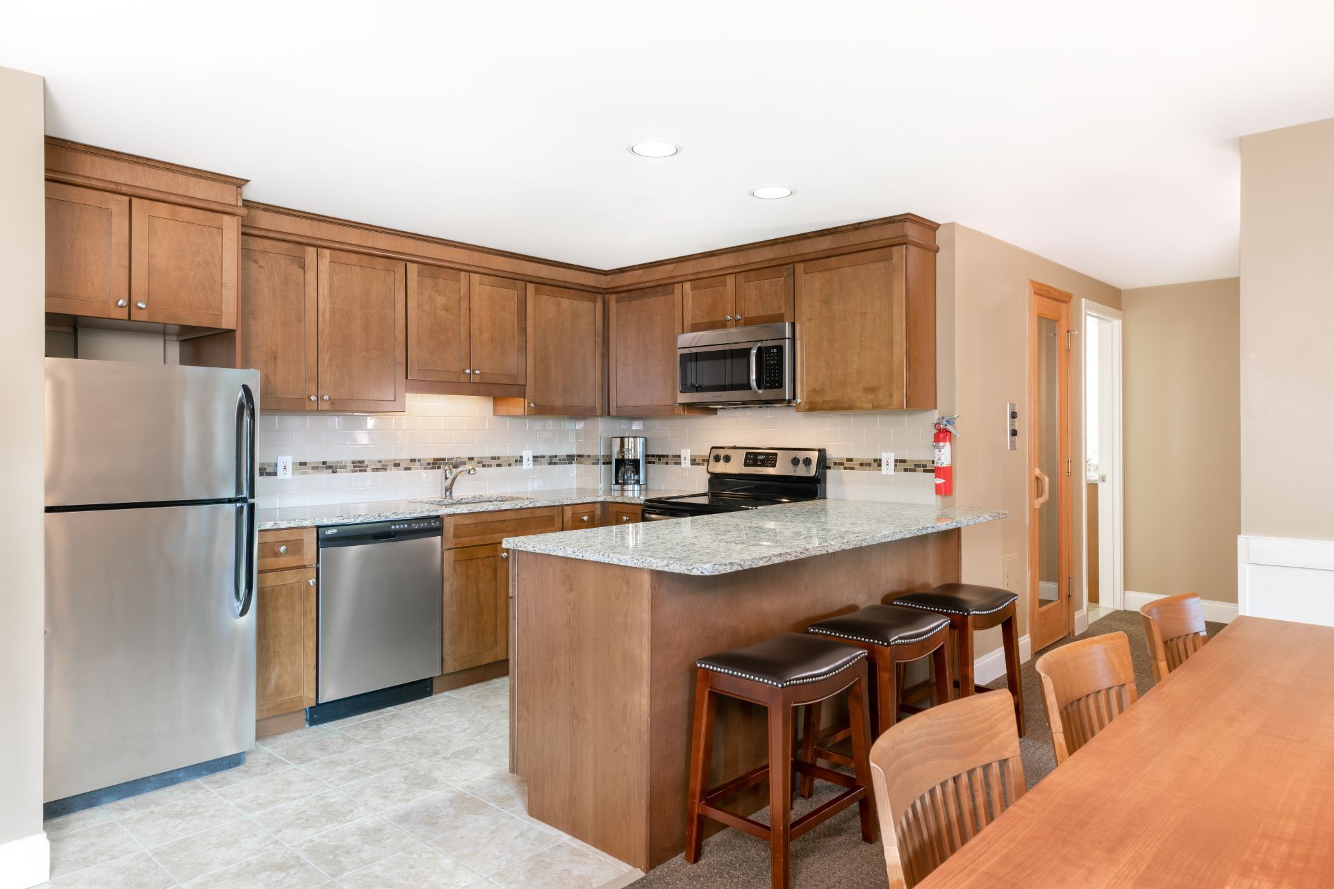 image Fully equipped kitchen with stainless-steel appliances, ample counter space, and a dining area ideal for family meals or après-ski gatherings.