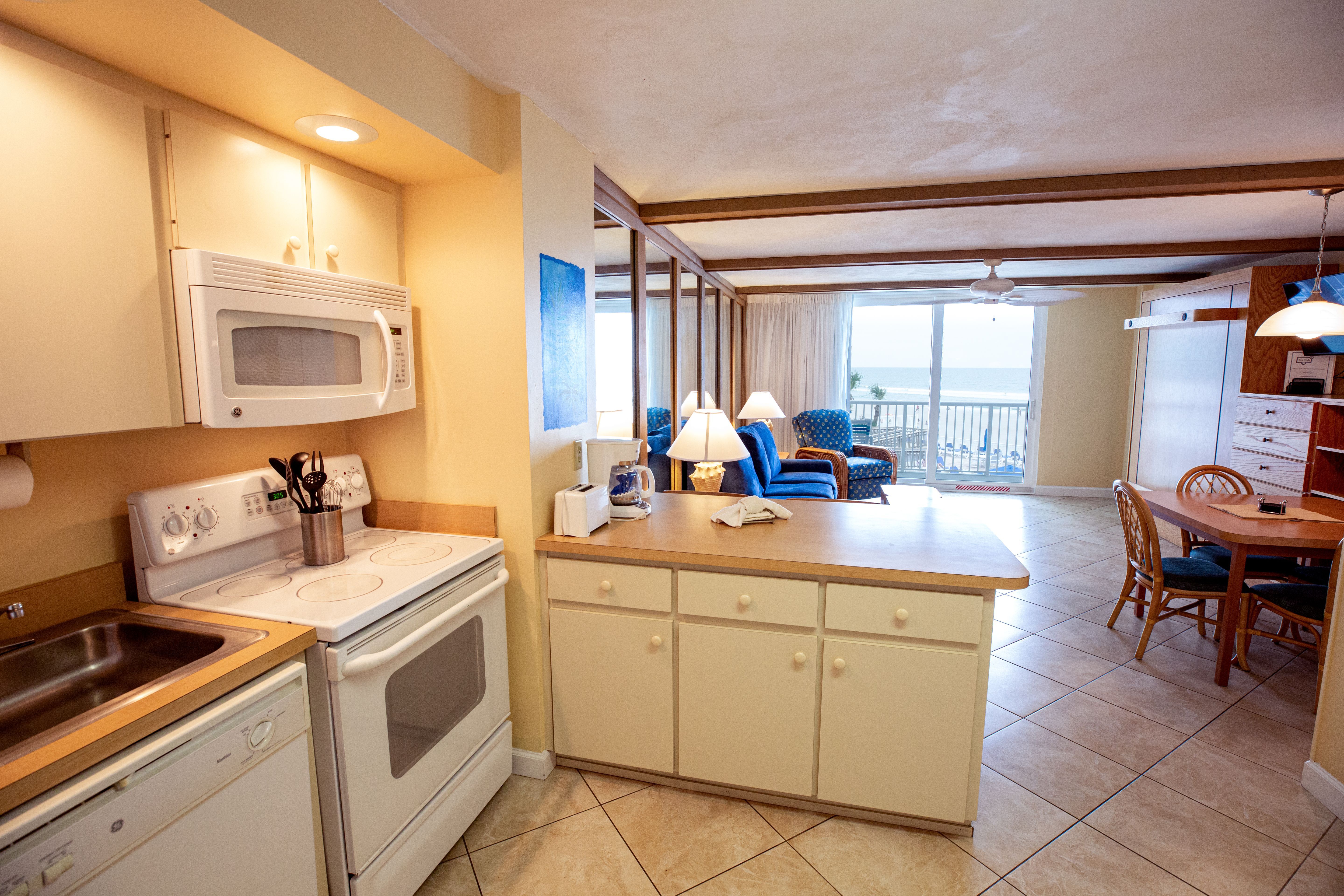 image The fully equipped kitchen offers modern appliances and ample counter space, making it easy to prepare meals while enjoying ocean vistas.
