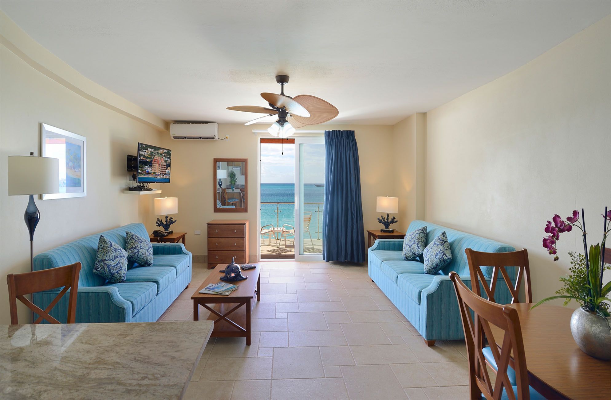 image Enjoy stunning ocean views from the cozy living room, which flows effortlessly onto the private balcony for moments of relaxation.