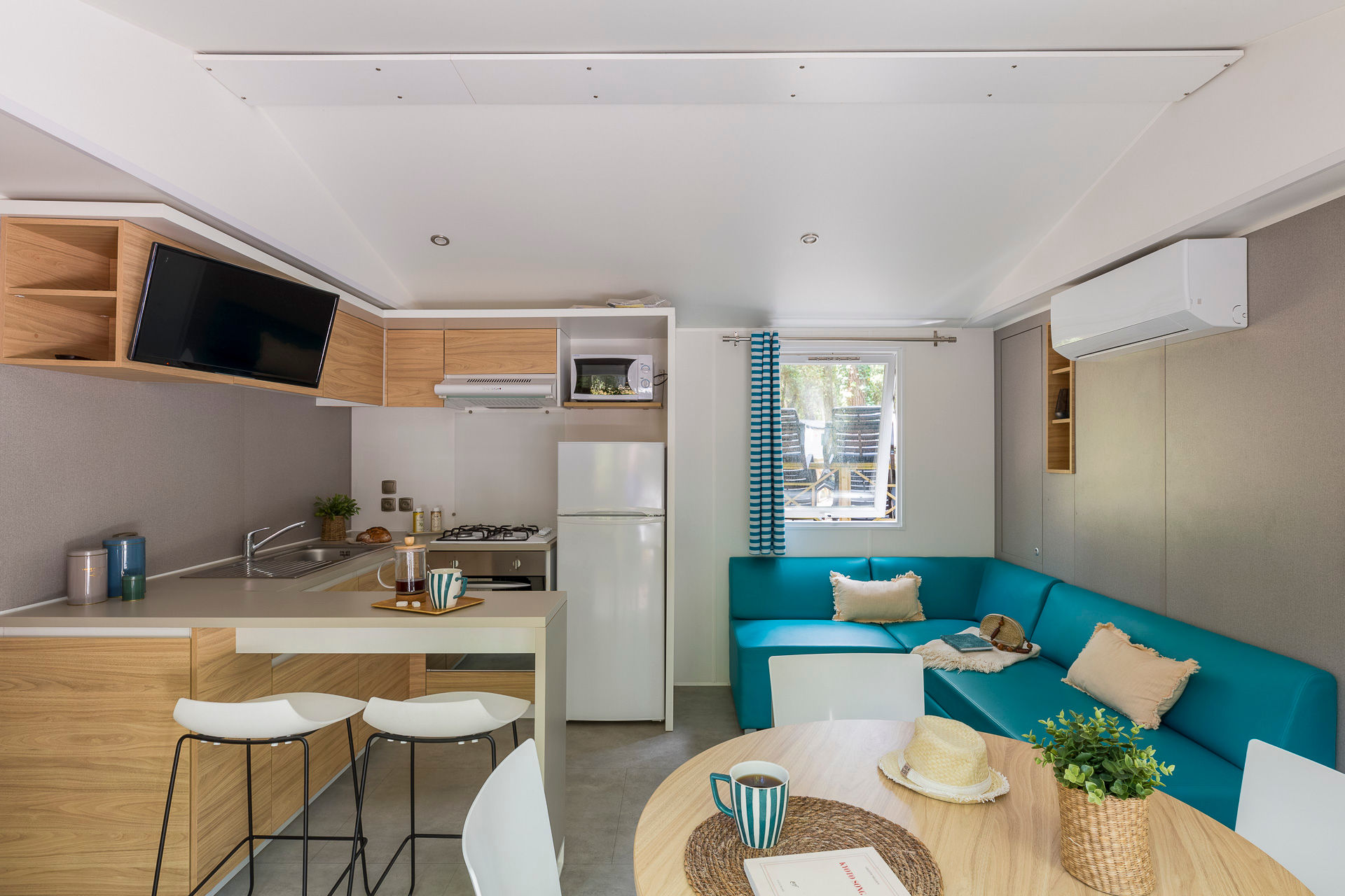 image Inside, the modern kitchen area, complete with stylish cabinetry and an open layout, invites you to prepare meals while enjoying the comfort of the living space.