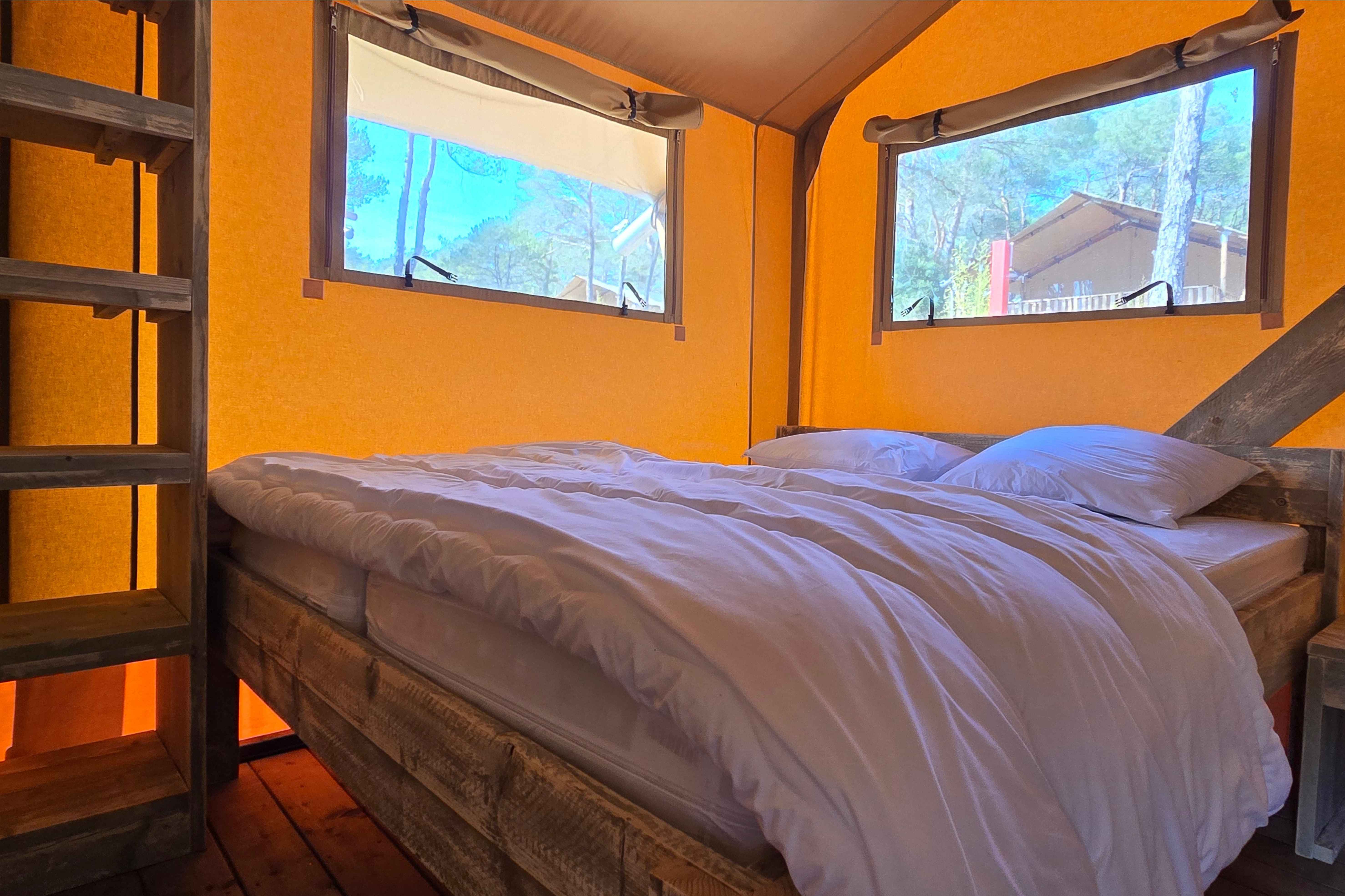 image The master bedroom boasts a comfortable double bed, abundant natural light, and a serene ambiance for restful nights.