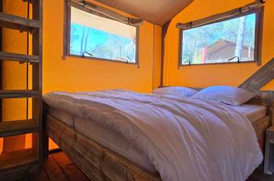 The master bedroom boasts a comfortable double bed, abundant natural light, and a serene ambiance for restful nights.