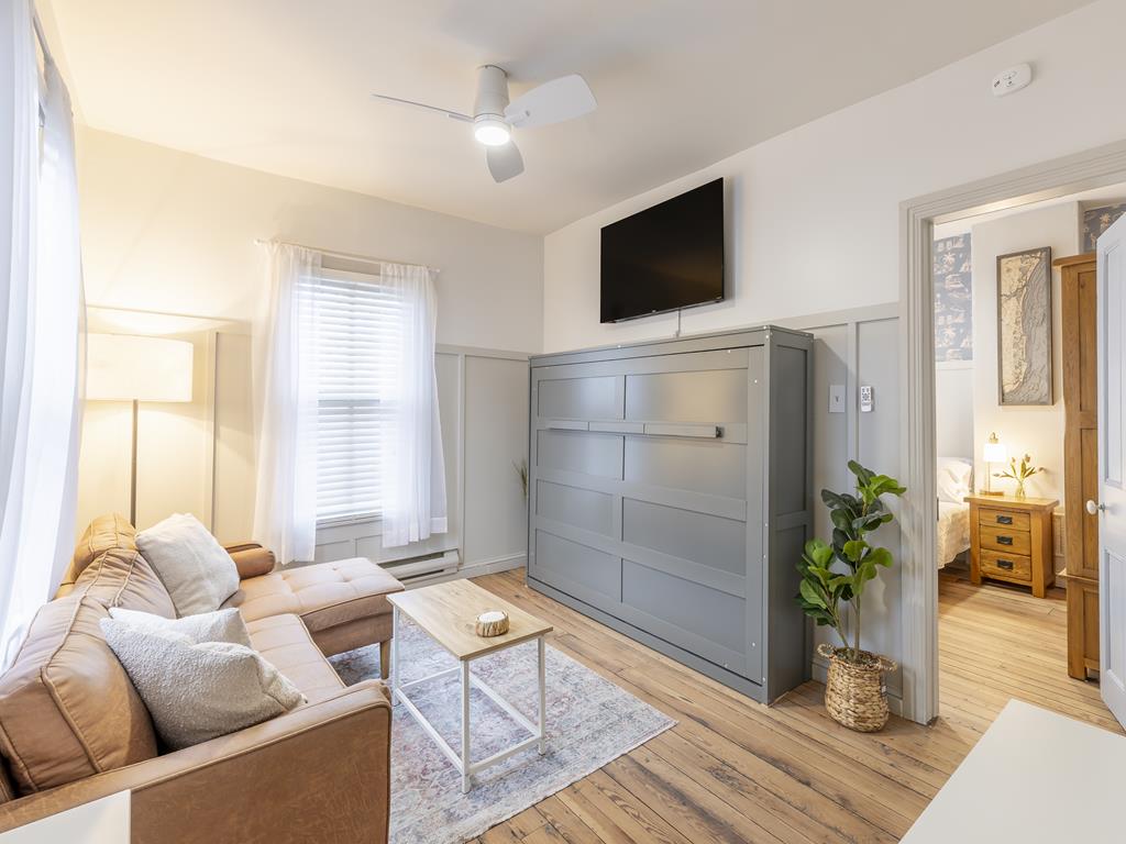 image Enjoy cozy evenings or casual lounging in the stylish, multi-functional living room.