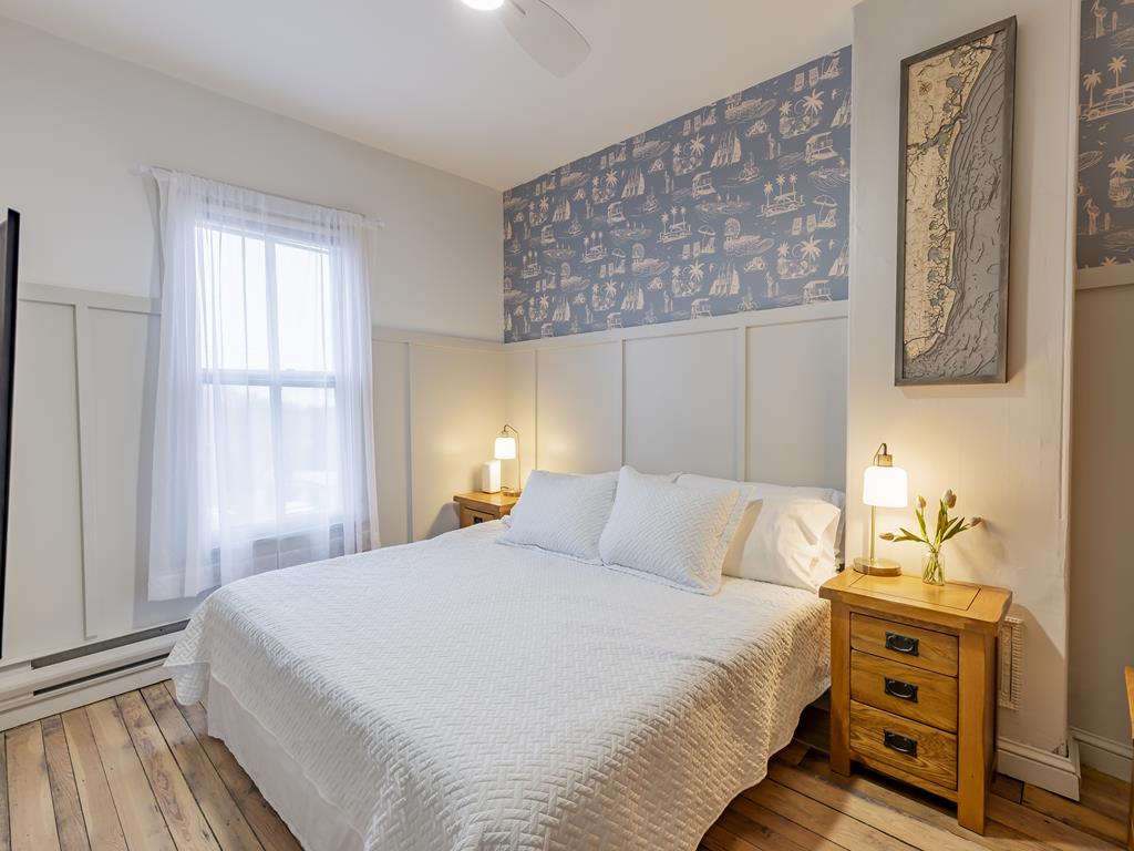 image The serene bedroom features a plush king-size bed and soft lighting for restful nights.