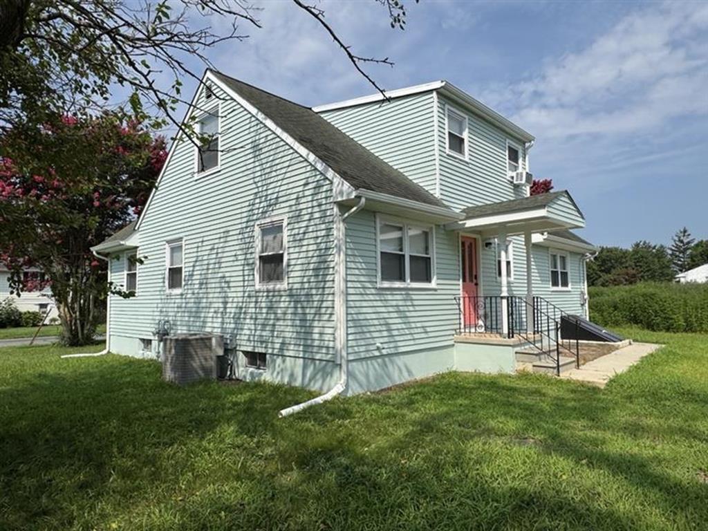 image Stroll along the peaceful side yard surrounded by lush greenery and sunlight.