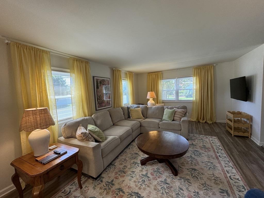 image Bask in soft natural light from large windows and golden curtains.