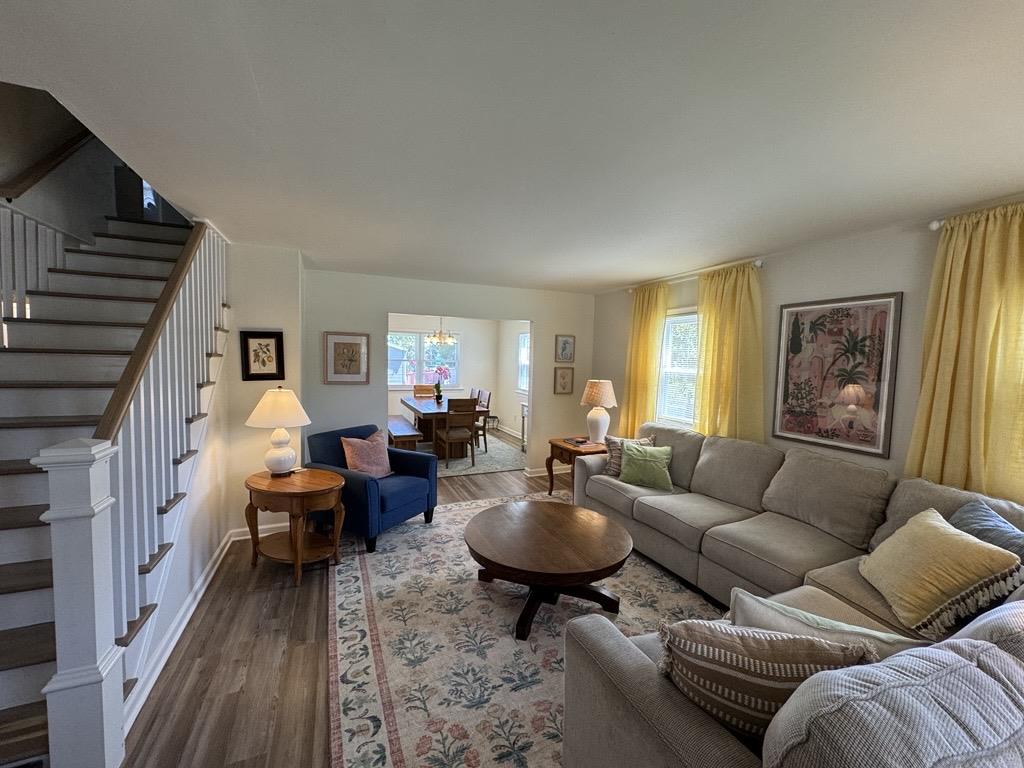 image Bright, open living room with cozy seating and a relaxed coastal feel.