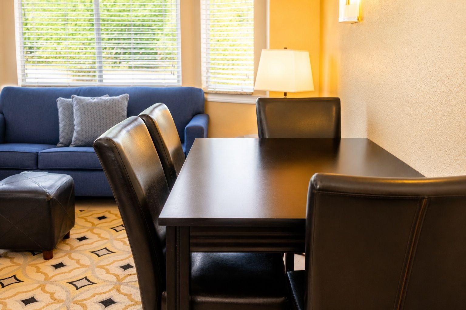 image Dining setup with a stylish table, elegant plates, and a view of the living room.