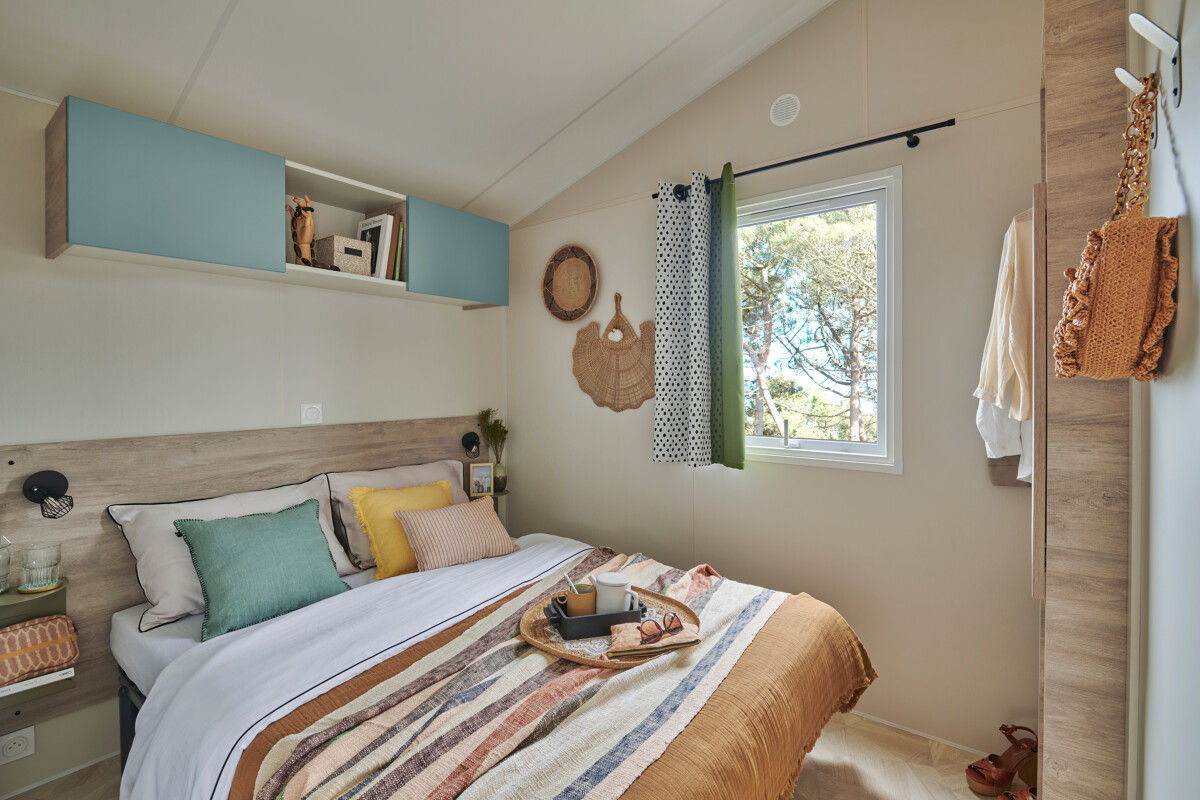 image The comfortable main bedroom features stylish decor and soft textiles, creating a serene retreat for guests.