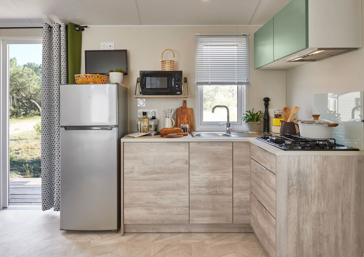 image In the well-equipped kitchen, modern appliances and a functional layout create an ideal space for meal preparation.