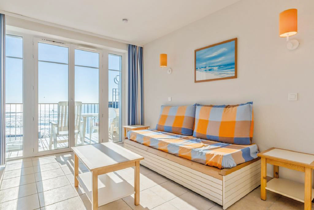 image Relax on the daybed with natural light flowing in, creating a warm and charming atmosphere.