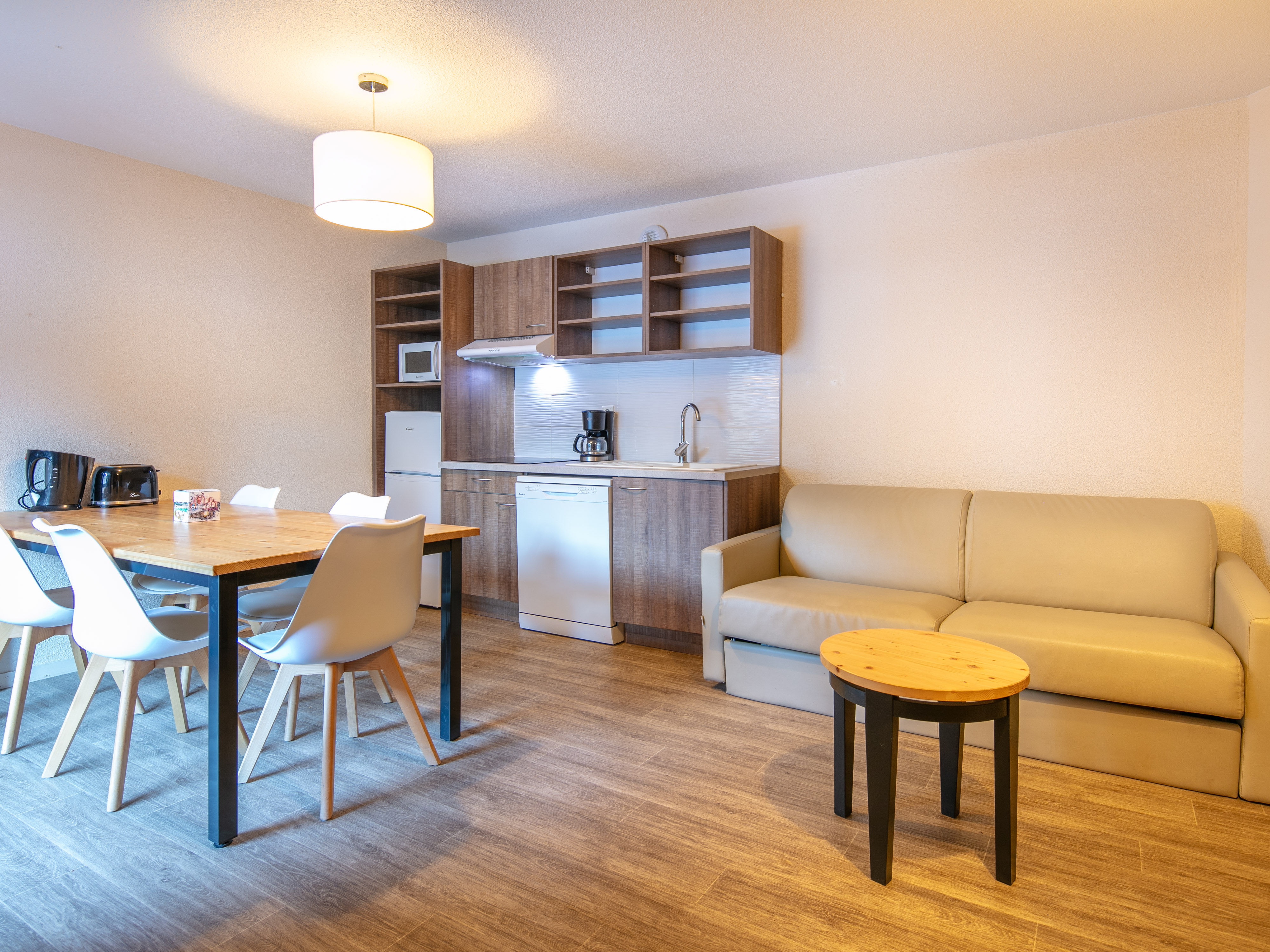 image This inviting living space boasts a spacious layout, perfect for social gatherings, complemented by warm alpine decor.