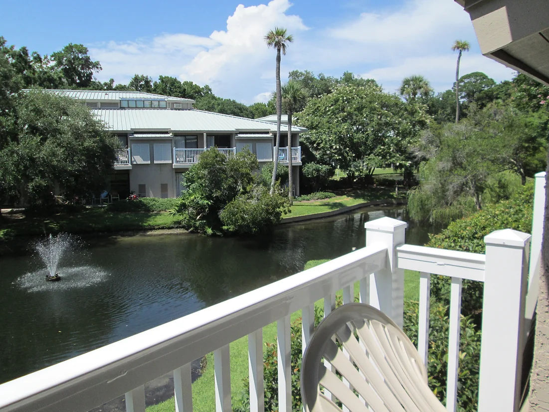 image Take in peaceful views from your private balcony overlooking lush resort grounds.