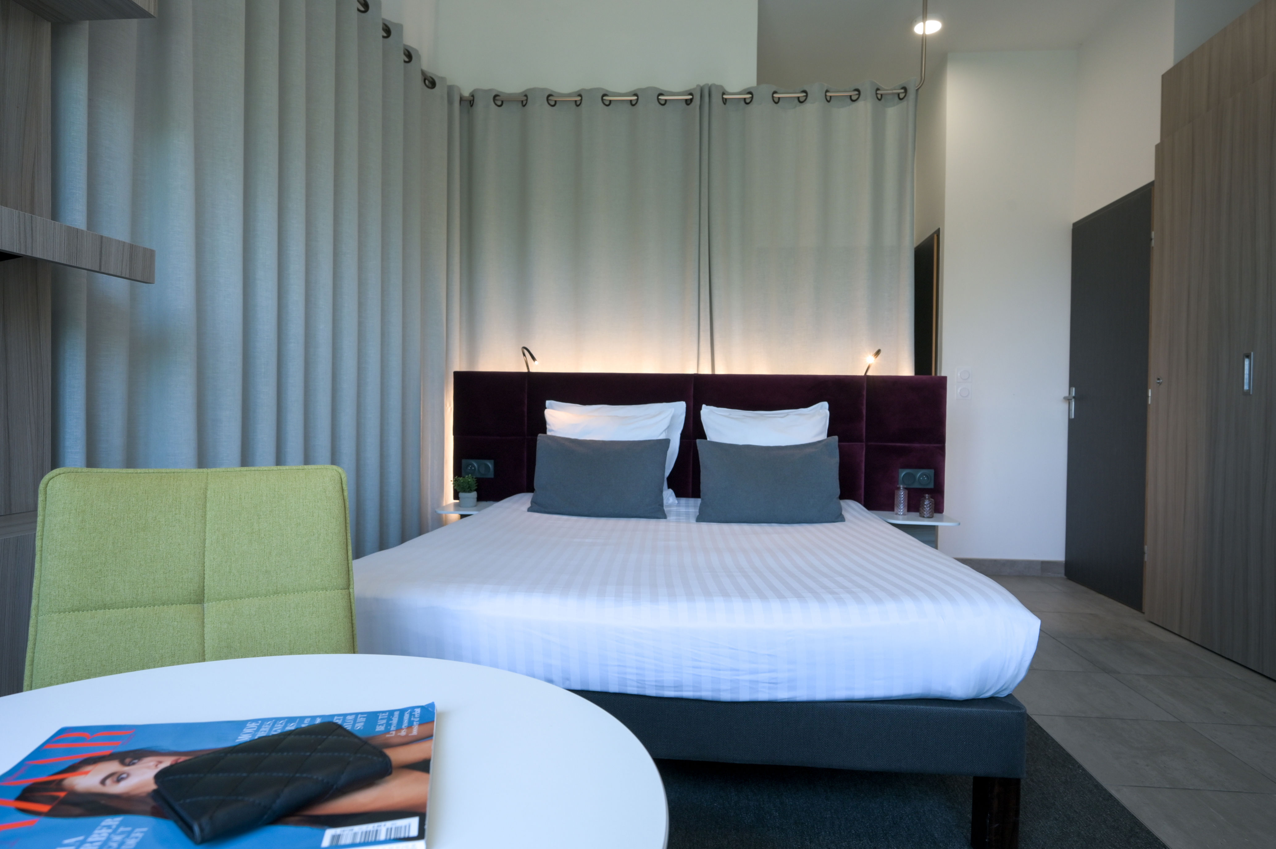 image Inviting double bed with modern finishes and soft lighting for a restful stay.