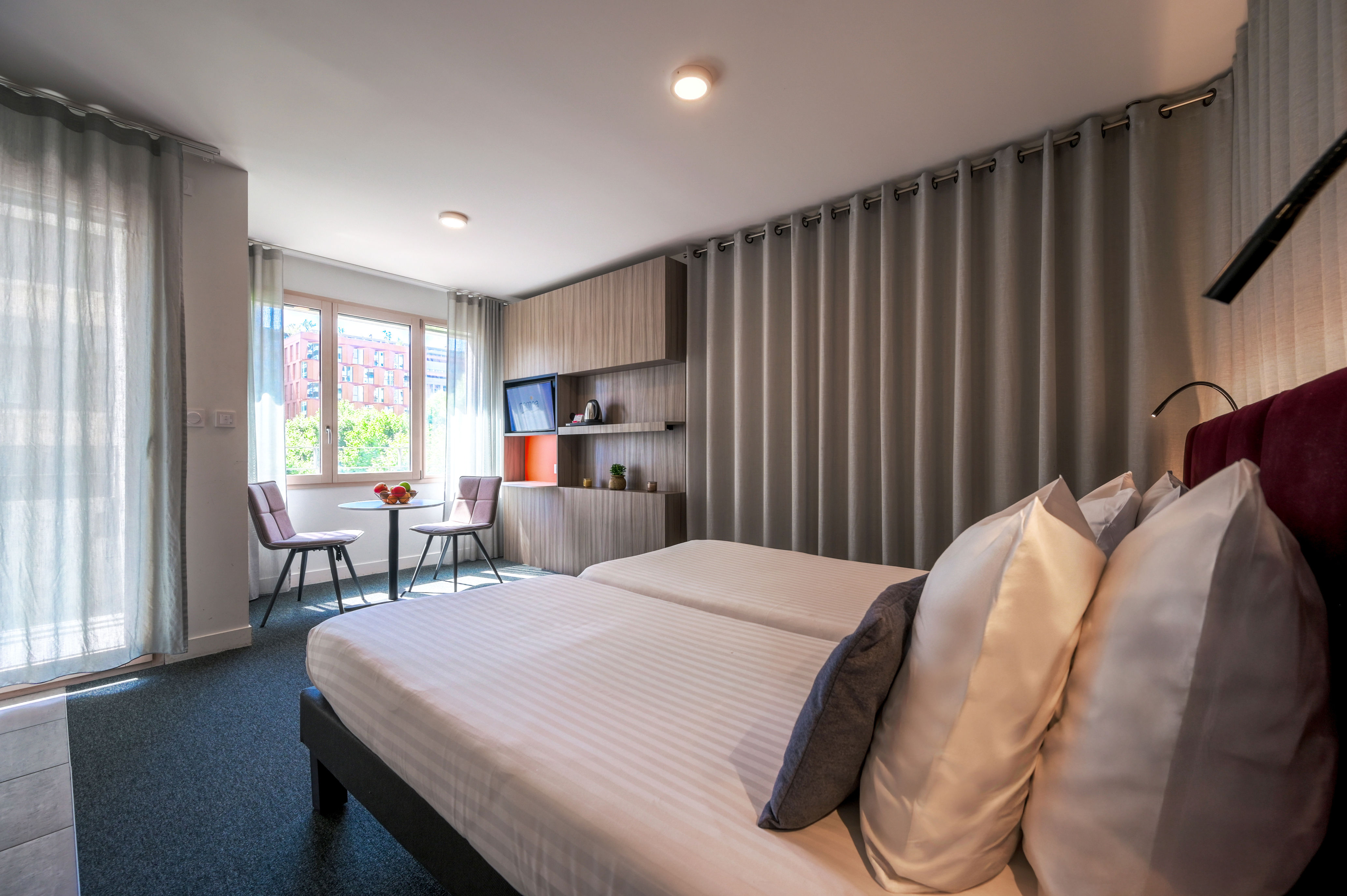 image Comfortable double bed in a contemporary studio designed for couples or two guests.