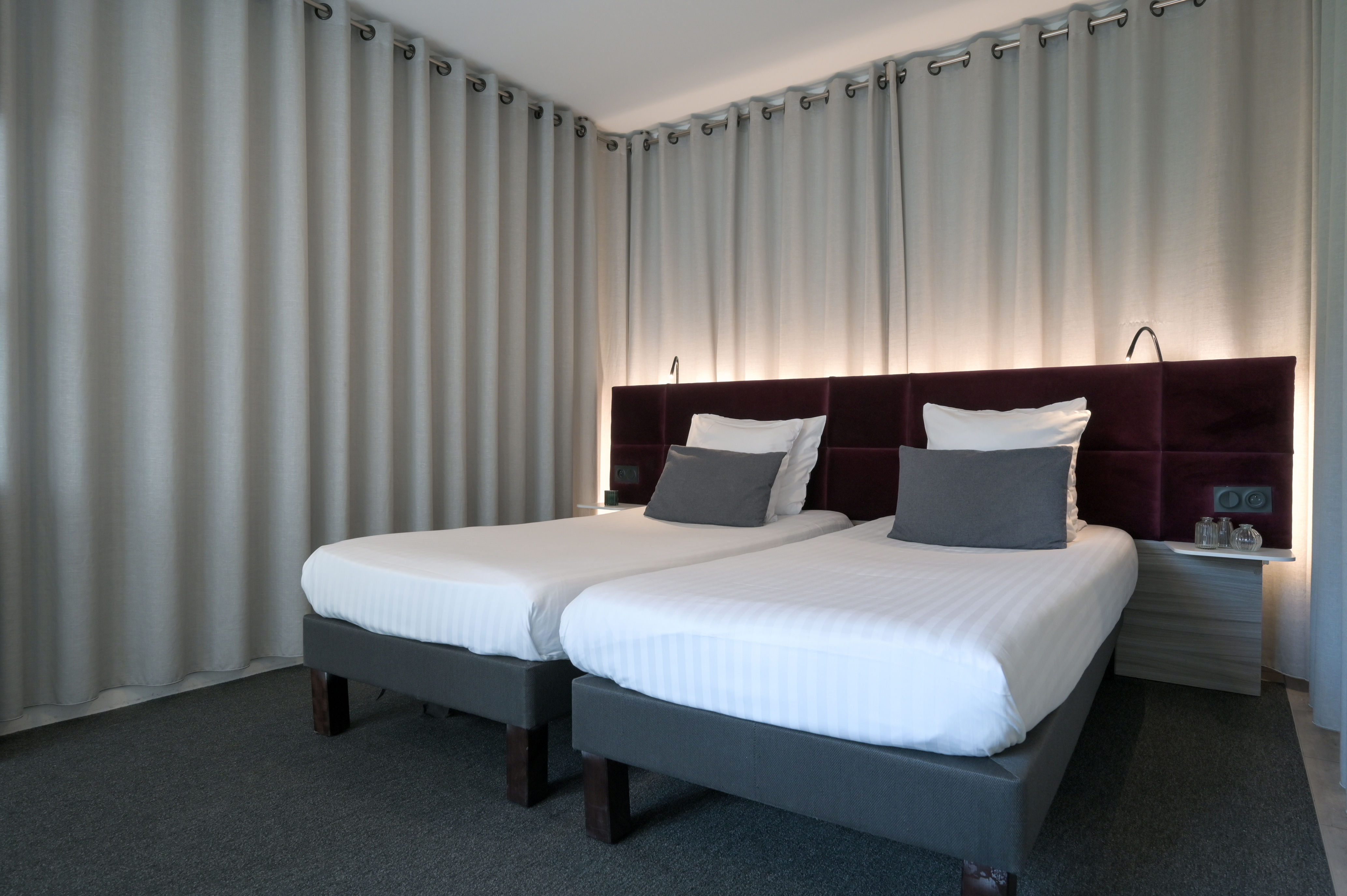 image Well-appointed sleeping area with soft lighting and elegant décor.