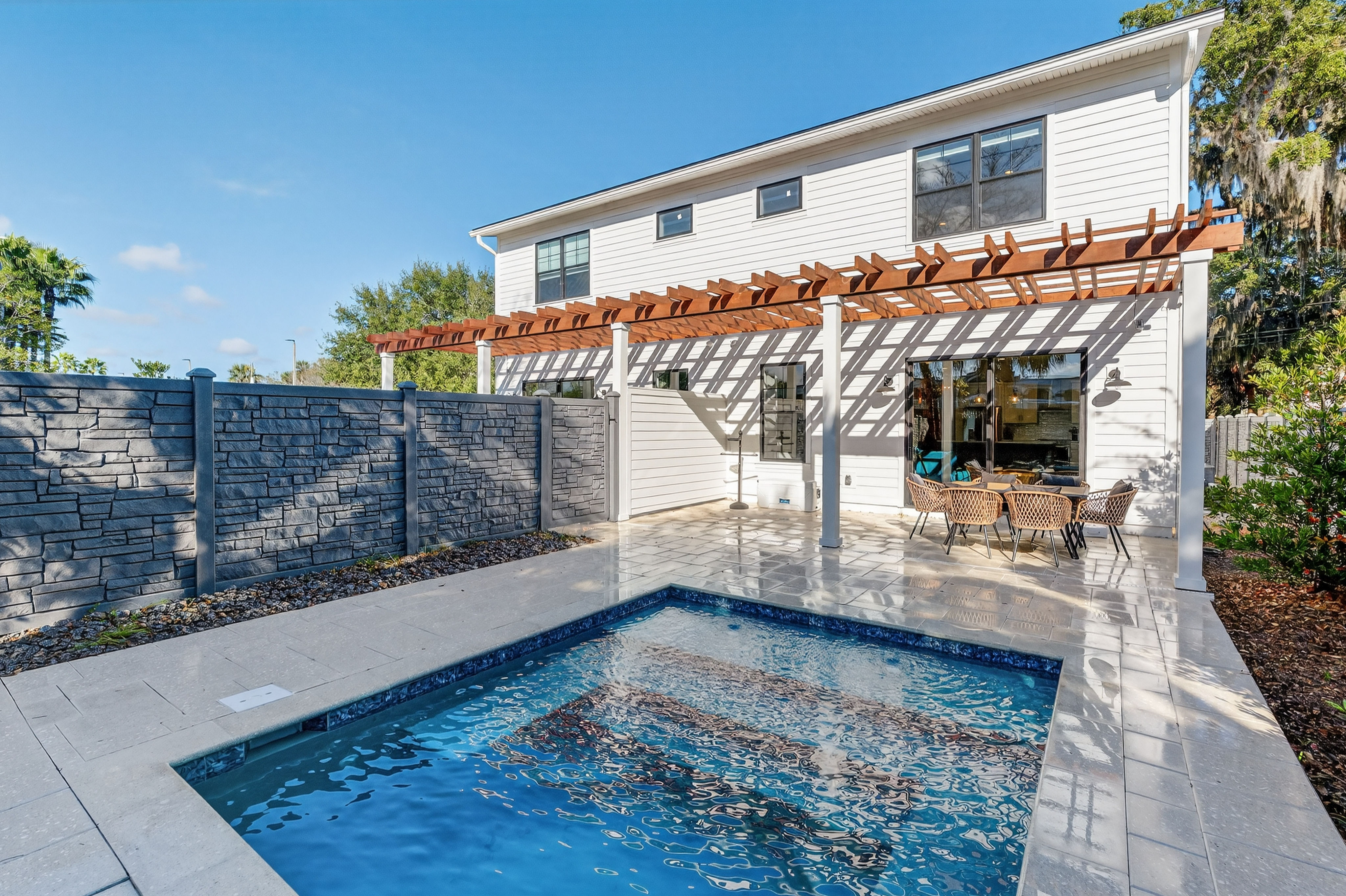 image Lounge beneath the pergola and enjoy tranquil poolside moments in true St. Augustine style.