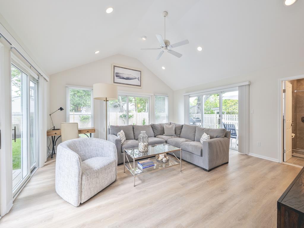 image Open and airy living room filled with natural light, featuring stylish furnishings and cozy seating.