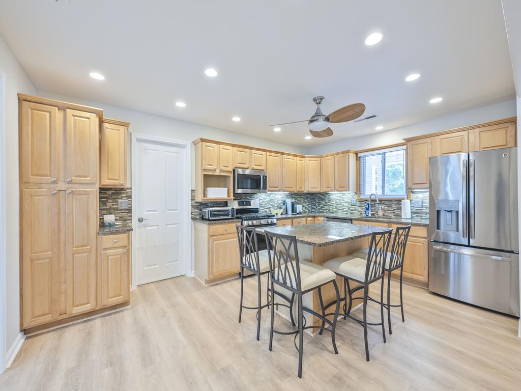 image View of the open kitchen highlighting stylish finishes and ample storage space.
