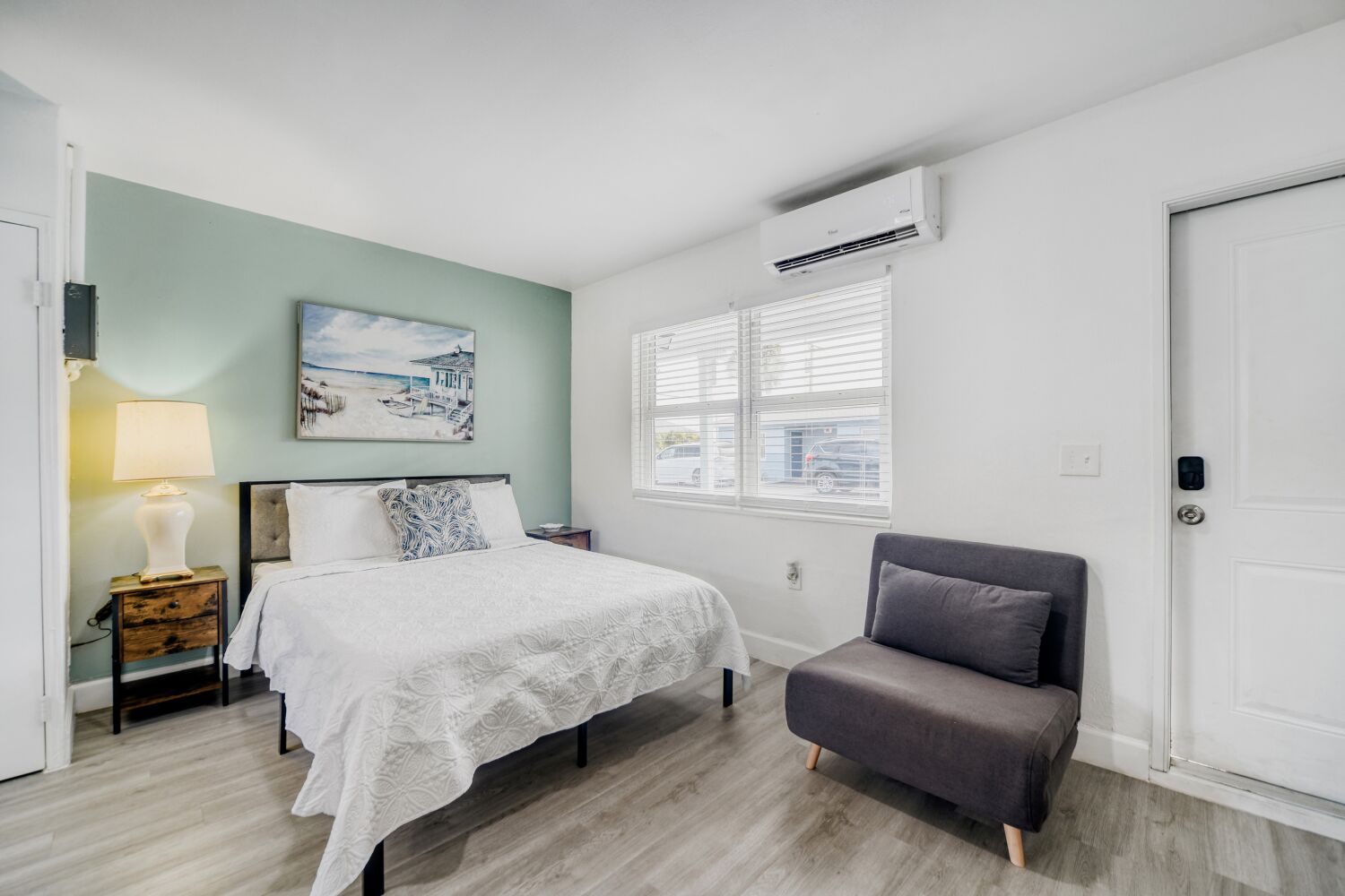 image Bright sleeping area provides a soft bed, reading lamp, and blackout curtains, ensuring restful nights and relaxing mornings.