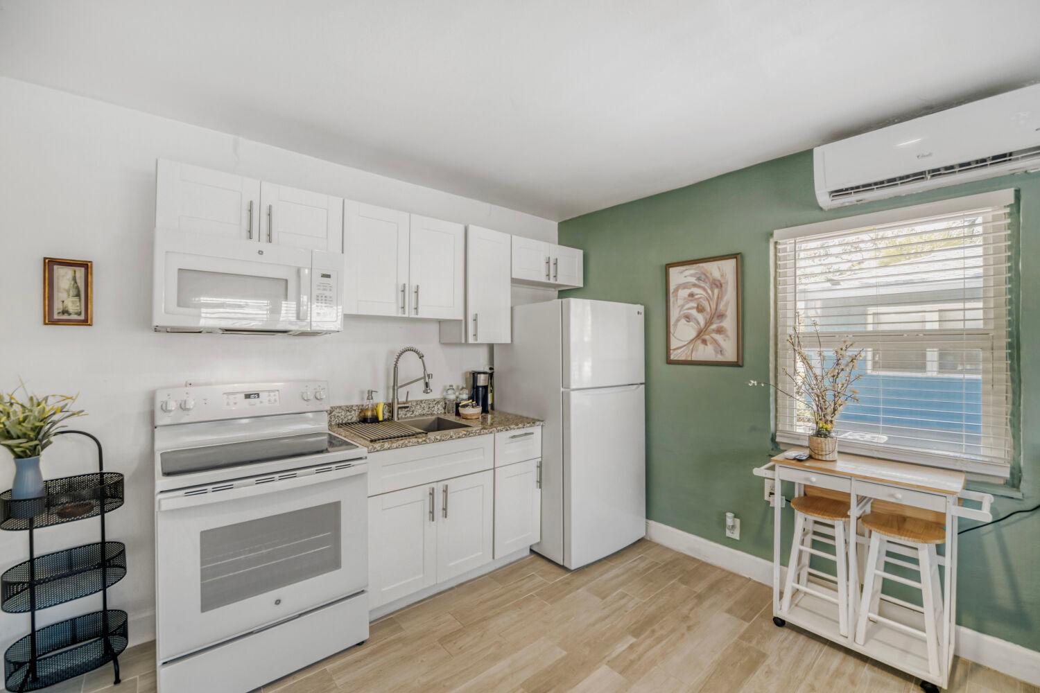 image Small dining and workspace table positioned beside the studio kitchenette.
