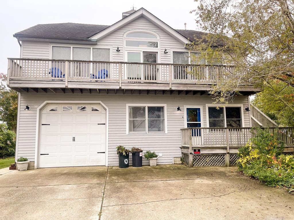 image This charming two-story home features a spacious deck and welcoming exterior, creating an inviting first impression.
