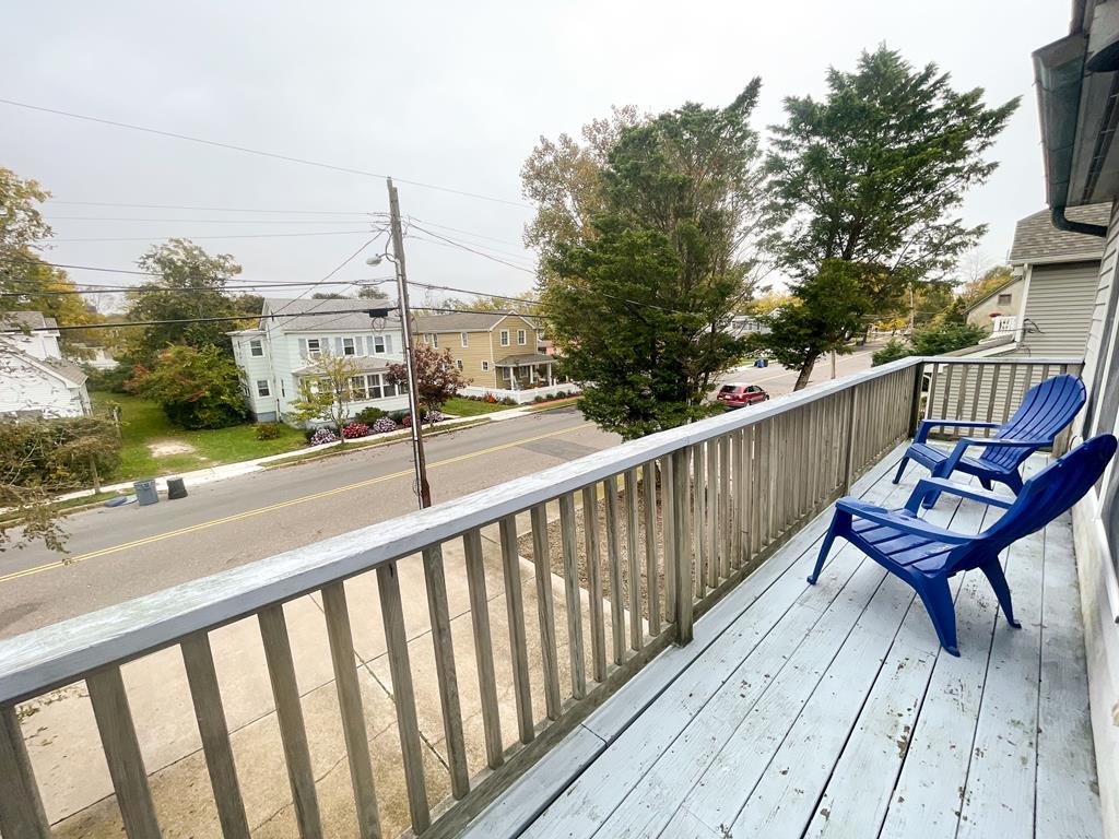 image The private balcony offers comfortable seating and a peaceful neighborhood view, perfect for enjoying fresh air.