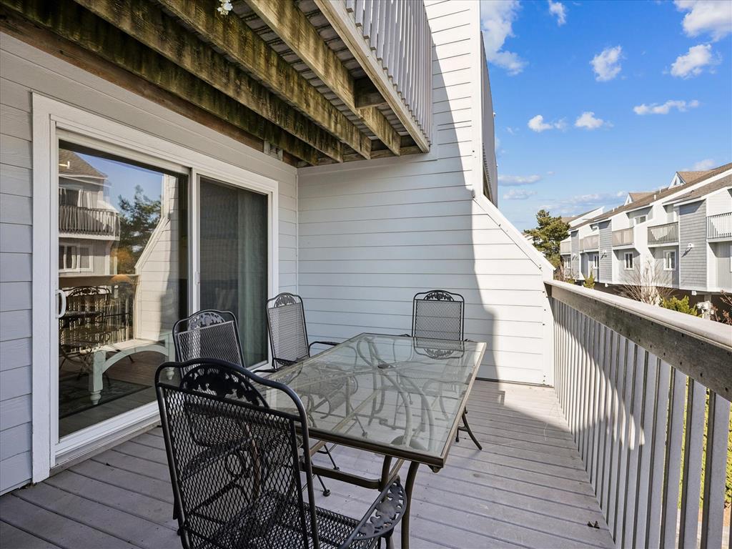 image Private deck dining set is perfect for al fresco family meals, morning coffee, and evening ocean-breeze sunsets.