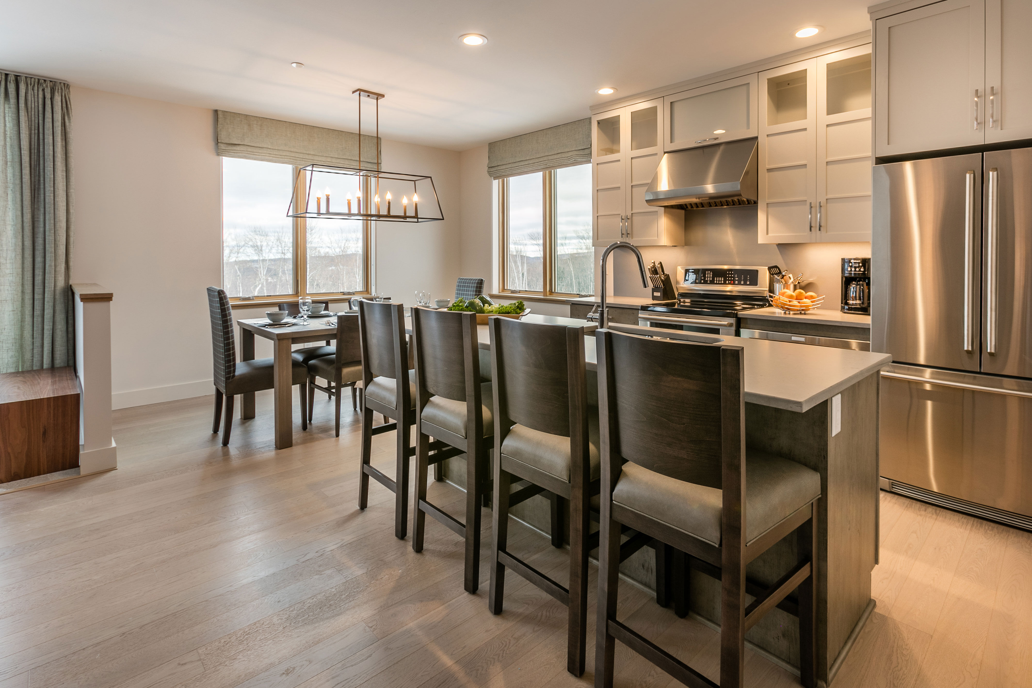 image Bathed in natural light, the dining area offers comfortable seating and a welcoming space to gather after mountain adventures.