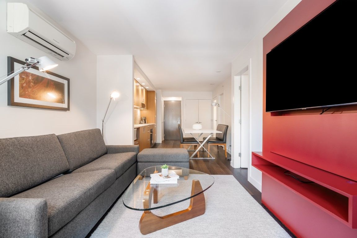 image With its open floor plan, the living space seamlessly connects to the kitchen and dining area, providing a comfortable environment perfect for relaxation or entertaining guests.