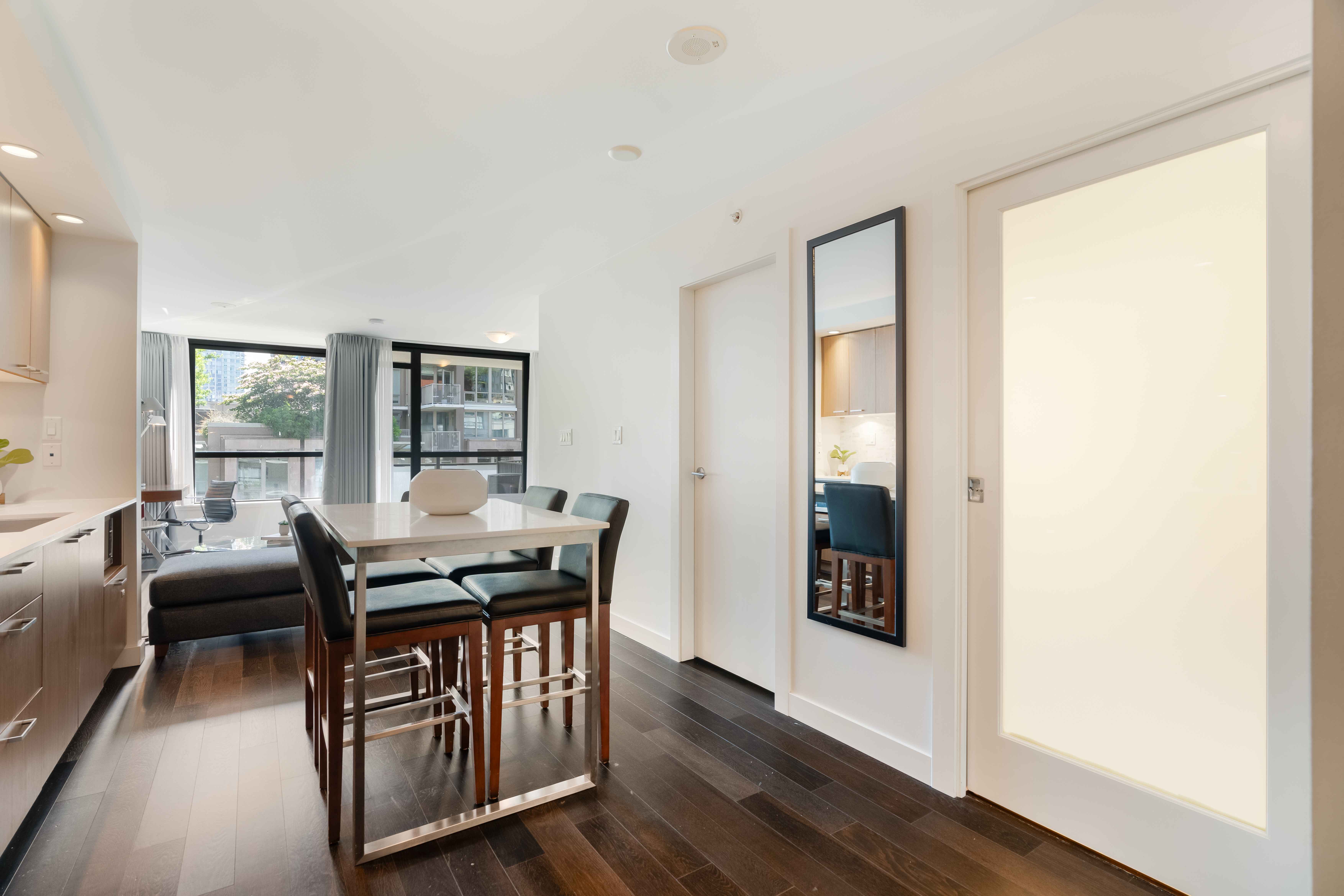 image Open-concept dining area seamlessly connected to the living space, ideal for meals or casual work sessions.