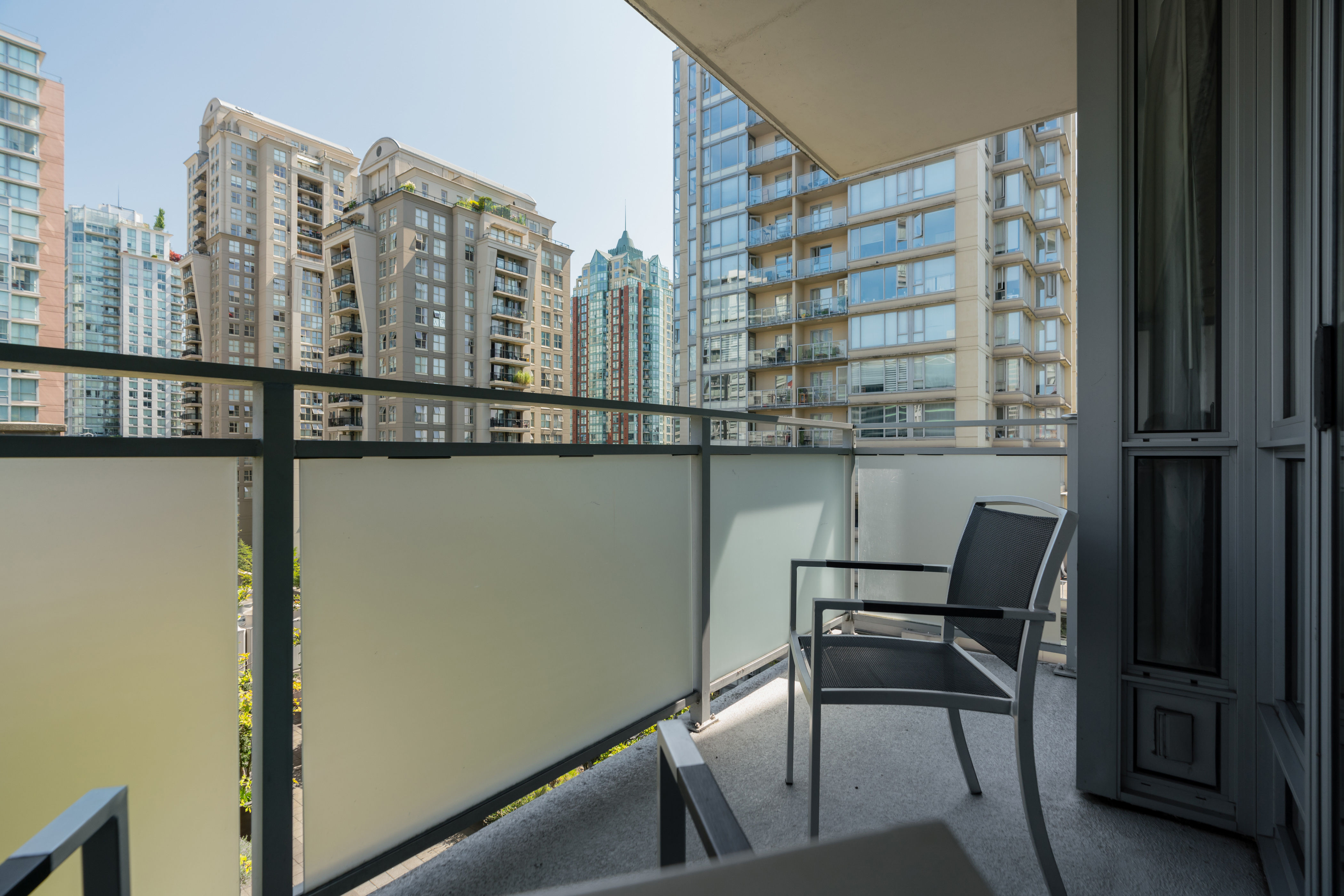 image Step out onto the private balcony to enjoy stunning views of Vancouver's urban landscape, perfect for morning coffee or evening relaxation.