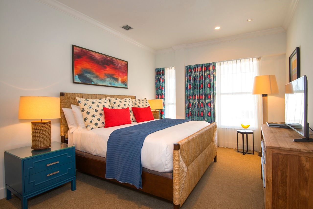 image Vibrant and inviting, this bedroom invites relaxation with playful patterns and rich hues that capture the spirit of coastal living. A perfect retreat for rejuvenation after sun-soaked adventures.