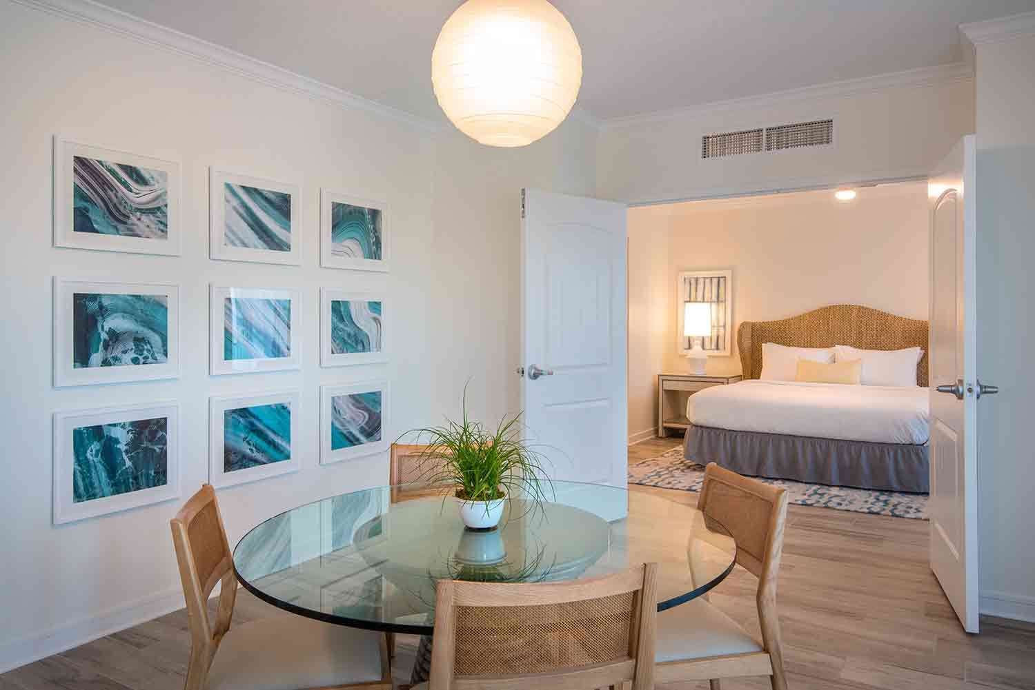 image Savor moments of connection in the airy dining space, adorned with ocean hues, inviting light, and a touch of coastal elegance.