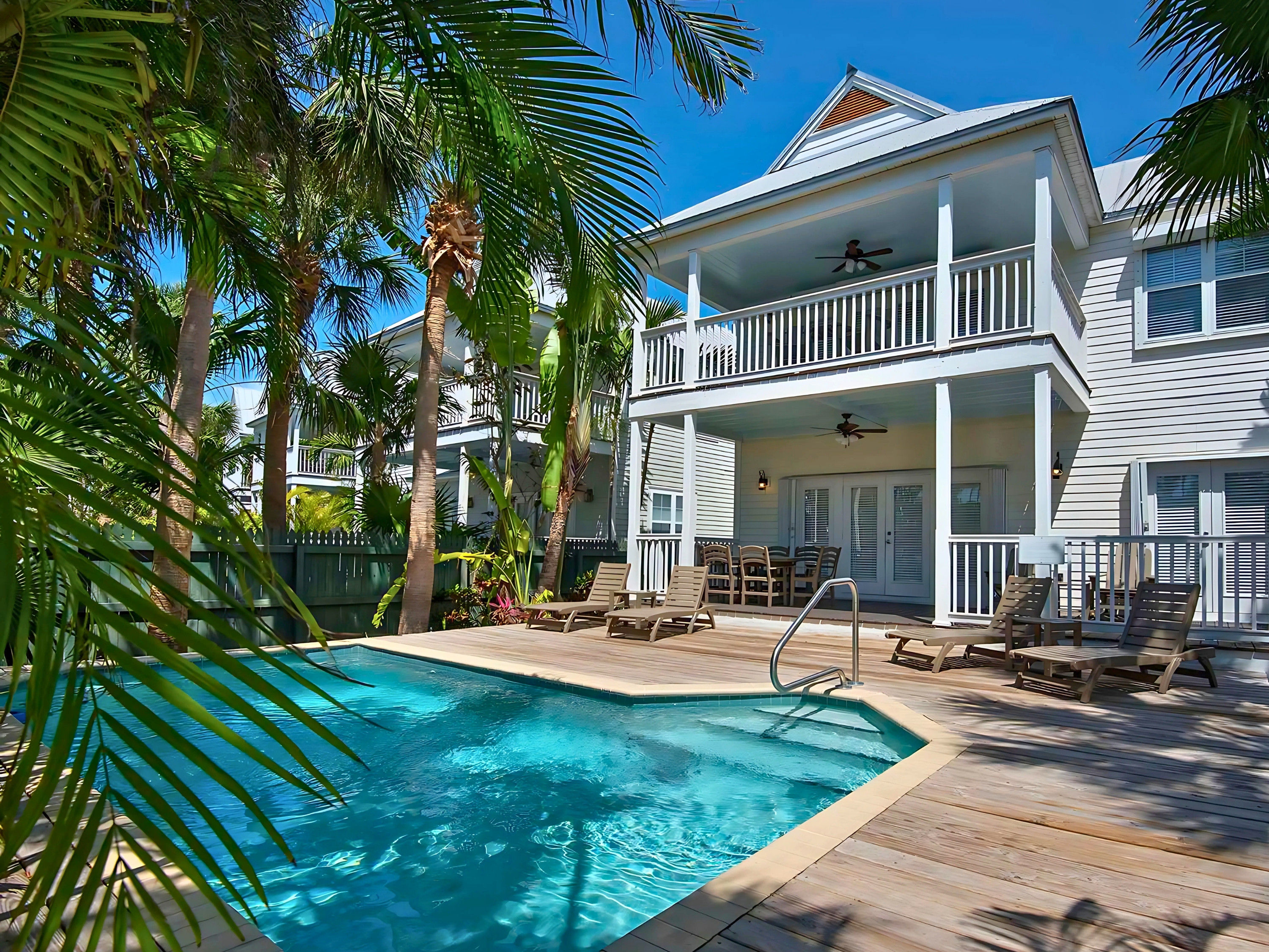 image Splash into paradise! This stunning private pool surrounded by lush greenery invites you to relax and make unforgettable memories.