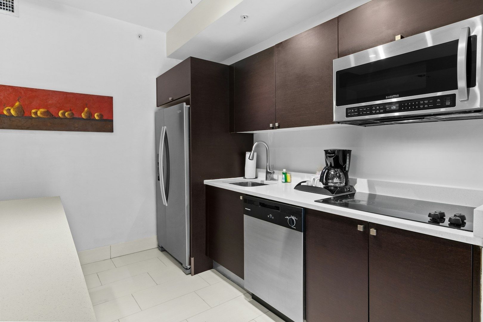 image Spacious kitchen with modern appliances perfect for home-cooked meals.
