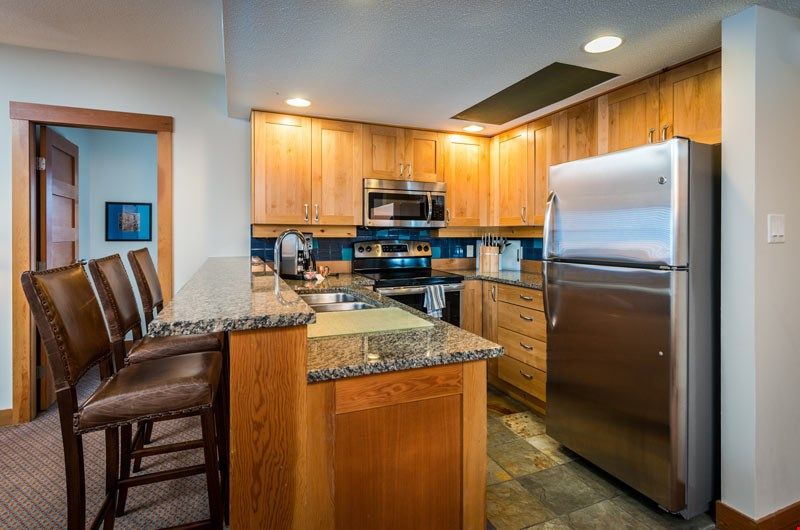 image Take a seat at the breakfast bar or cook up a storm in the fully-equipped kitchen.