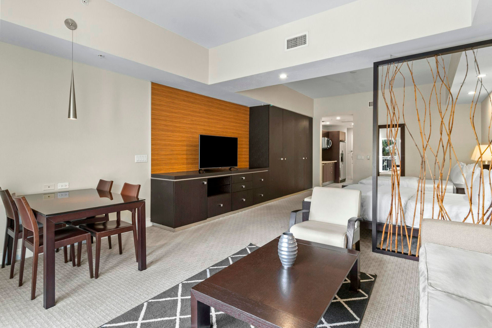 image Spacious living and dining area with modern furnishings and an open layout designed for comfort and easy movement.