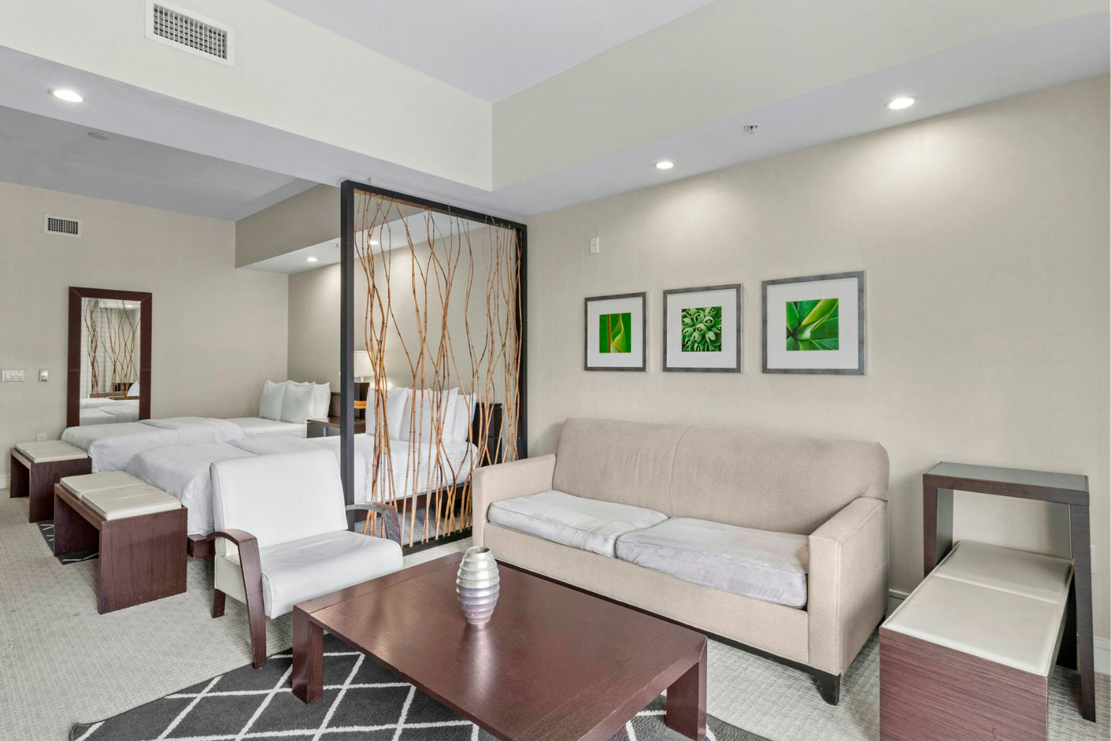 image Accessible studio layout with two comfortable beds and a bright, modern design suited for a relaxing Miami stay.